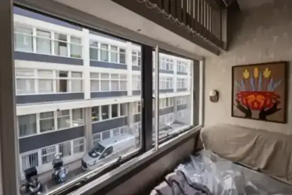 A serene London bedroom overlooking a busy street, kept silent by secondary glazing