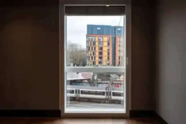A secondary glazing installation in a London period property overlooking a transit line, providing silence while maintaining heritage looks